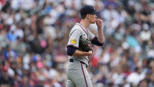 Atlanta Braves starting pitcher Max Fried reacts after giving up a three-run home run to Colorado Rockies' Sam Hilliard in the second inning of a baseball game Saturday, Aug. 10, 2024, in Denver. (AP Photo/David Zalubowski)