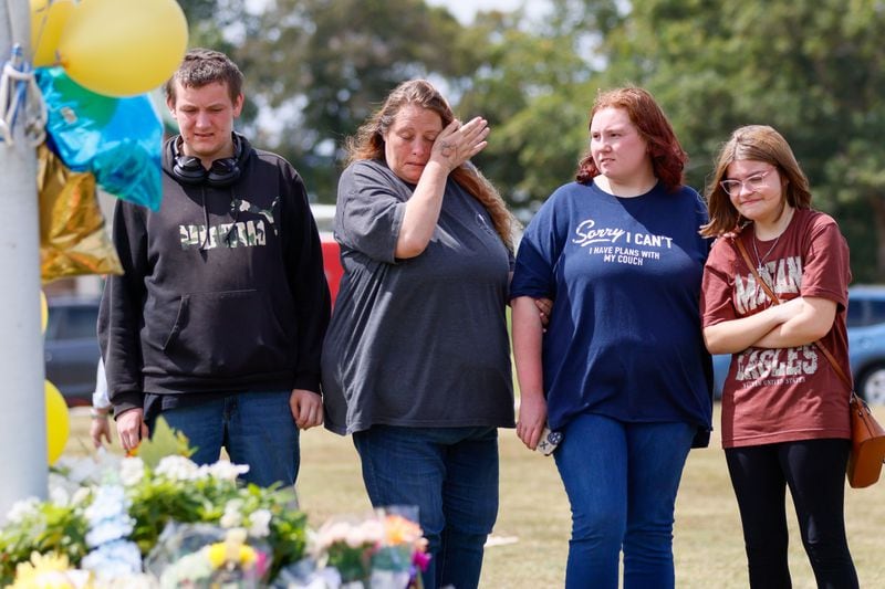 April Johnson (second from left) said she's worried about her daughter Jasmine (second from right) returning to school. She was shocked that a school shooting happened in the small, close-knit town of Winder. (Miguel Martinez/AJC)