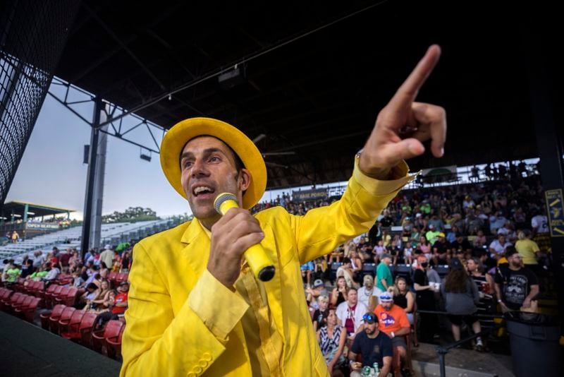 Savannah Bananas owner Jesse Cole, center, looks for contestants during a performance before the start of a home game at Historic Grayson Stadium. (AJC Photo/Stephen B. Morton)