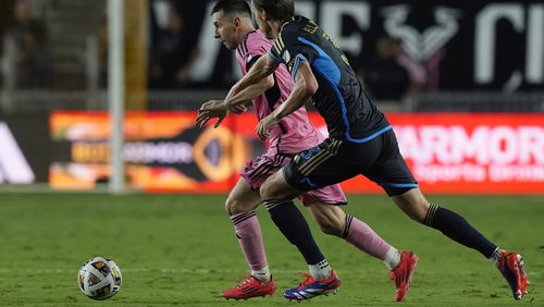 Inter Miami forward Lionel Messi (10) and Philadelphia Union defender Jack Elliott (3) go after the ball during the second half of an MLS soccer match, Saturday, Sept. 14, 2024, in Fort Lauderdale, Fla. (AP Photo/Marta Lavandier)