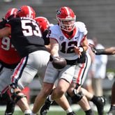 Georgia's quarterback Brock Vandagriff (12) makes a handoff during the G - Day game at Sanford Stadium, Saturday, April 15, 2023, in Athens. (Hyosub Shin / Hyosub.Shin@ajc.com) 