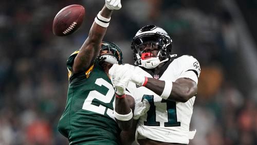 Green Bay Packers cornerback Keisean Nixon (25) breaks up a pass intended for Philadelphia Eagles wide receiver A.J. Brown (11) during the first half of an NFL football game, Friday, Sept. 6, 2024, at the Neo Quimica Arena in Sao Paulo. (AP Photo/Doug Benc)