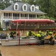 Atlanta Fire Rescue’s swift-water dive team performed welfare checks on residents on Hanover West Drive in Atlanta on Friday, Sept. 27, 2024, after Hurricane Helene caused major flooding in parts of Atlanta. (John Spink/AJC)