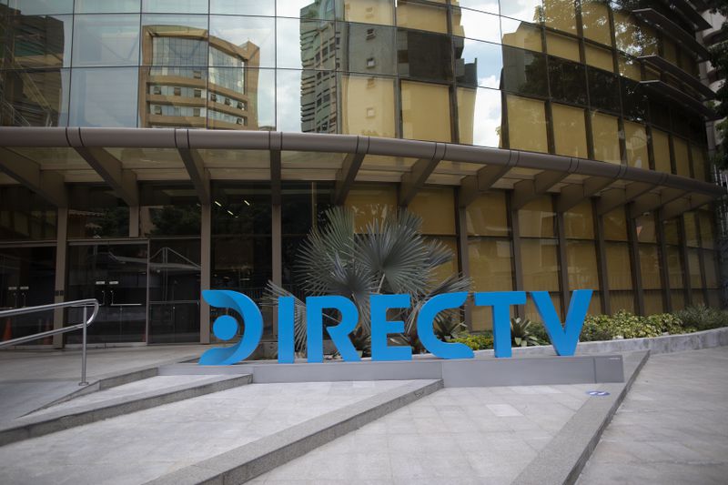 FILE - A DirectTV logo identifies the company's headquarters in Caracas, Venezuela, Friday, May 22, 2020. (AP Photo/Ariana Cubillos, File)