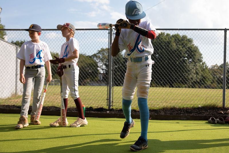 Dozens of Atlanta's young baseball players  try out upgrades made to Rosa L. Burney Park on Sept. 21, 2023 as part of a partnership between city officials, the Atlanta Braves and Truist.