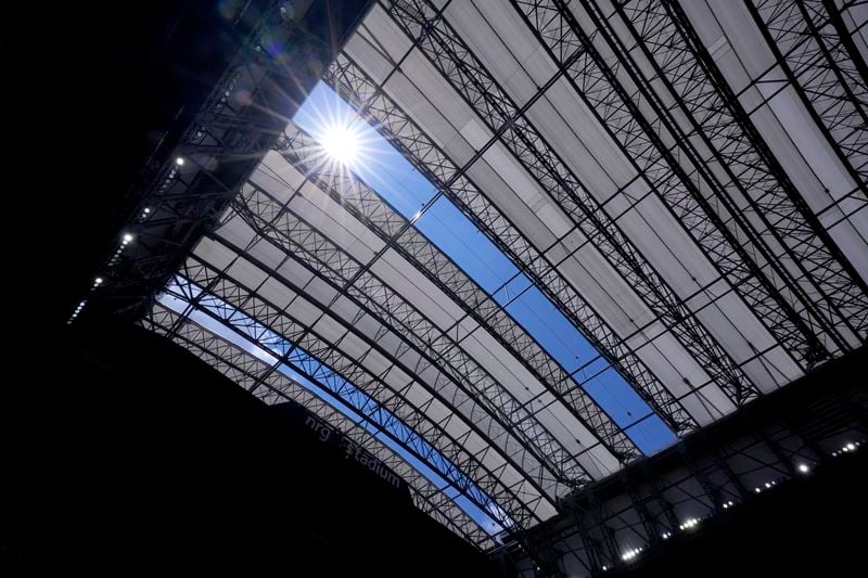 The sun shines thrown missing panels that were damaged by hurricane Beryl in the roof structure at NRG Stadium in the first half of a preseason NFL football game between the New York Giants and Houston Texans, Saturday, Aug. 17, 2024, in Houston. (AP Photo/Eric Gay)