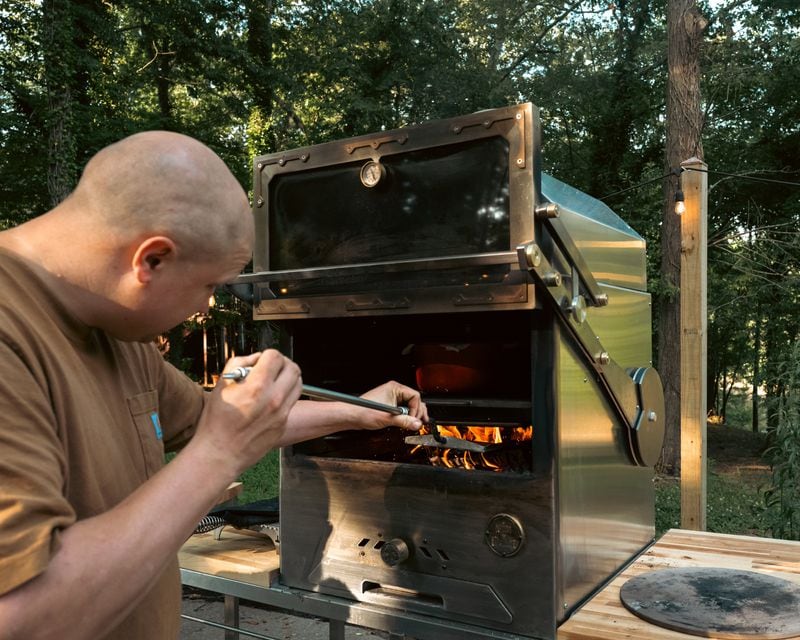 Chris Demant tests out his prototypes at home. (Courtesy of Savanna Hall/Grills by Demant)