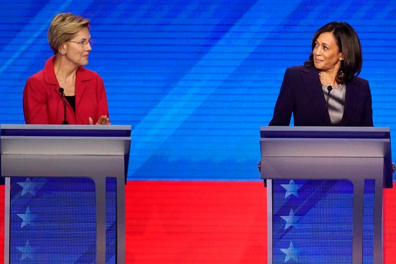 FILE - Democratic presidential candidate Sen. Elizabeth Warren, D-Mass., left and Sen. Kamala Harris, D-Calif., react, Sept. 12, 2019, during a Democratic presidential primary debate in Houston. (AP Photo/David J. Phillip, File)