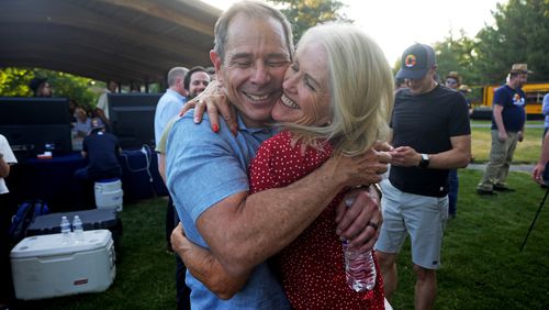 U.S. Rep. John Curtis receives a hug from his wife Sue after being announced the winner during an election night party, Tuesday, June 25, 2024, in Provo, Utah. Curtis has won the Utah GOP primary for Mitt Romney's open U.S. Senate seat, defeating one opponent who was endorsed by former President Donald Trump and others who said they supported Trump's agenda. (AP Photo/Rick Bowmer)