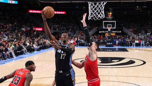 Atlanta Hawks forward Onyeka Okongwu (17) attempts a shot against Chicago Bulls center Nikola Vucevic (9) during the first half at State Farm Arena, Monday, February 12, 2024, in Atlanta. The Chicago Bulls won 136 - 126. (Jason Getz / jason.getz@ajc.com)