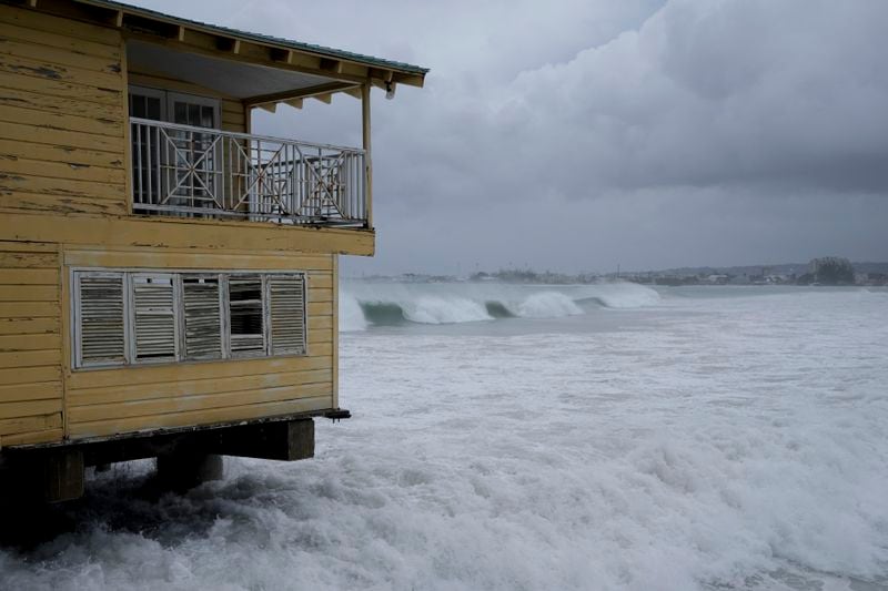 Waves batter a pier during the pass of Hurricane Beryl in Bridgetown, Barbados, Monday, July 1, 2024. (AP Photo/Ricardo Mazalan)