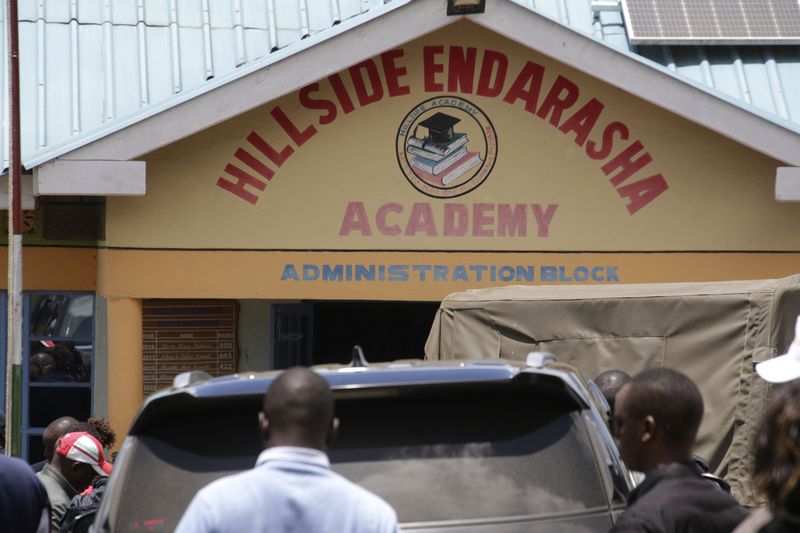 Distressed parents and relatives stand outside the administration block near a burned-out dormitory, following a fire at the Hillside Endarasha Primary in Nyeri, Kenya Friday, Sep. 6, 2024. (AP Photo)