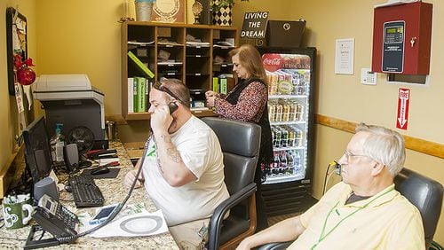 Missy Owen, executive director of the Davis Direction Foundation, and others work at The Zone in Marietta, Georgia, on Monday, June 25, 2018. The Zone is operated under the foundation to support people in recovery.