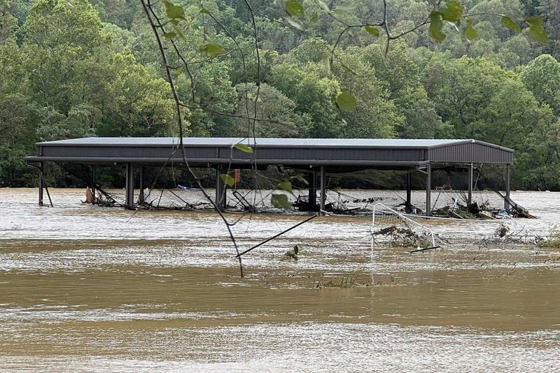 This photo provided by Kelly Benware shows flooding around the football field at Asheville Christian Academy in Swannanoa, N.C., on Friday, Sept. 27, 2024. (Kelly Benware via AP)