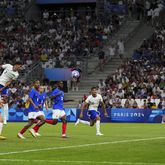 United States' Nathan Harriel, left, heads the ball during the men's Group A soccer match between France and the United States at the Velodrome stadium, during the 2024 Summer Olympics, Wednesday, July 24, 2024, in Marseille, France. (AP Photo/Daniel Cole)