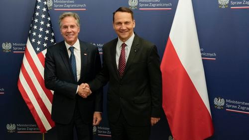 U.S. Secretary of State Antony Blinken, left, welcomes by Polish Foreign Minister Radosław Sikorski, right, for talks in Warsaw, Poland, Thursday, Sept. 12, 2024. (AP Photo/Czarek Sokolowski)