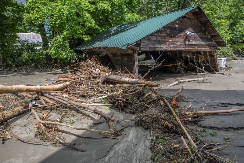 Debris is strewn about following flooding caused by the remnants of Hurricane Beryl, Thursday, July 11, 2024, in Plainfield, Vt. (AP Photo/Dmitry Belyakov)