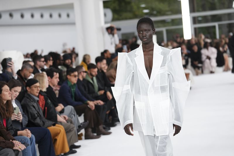 A model wears a creation as part of the Issey Miyake Spring/Summer 2025 collection presented Friday, Sept. 27, 2024 in Paris. (Photo by Scott A Garfitt/Invision/AP)