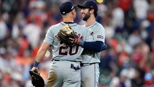 Detroit Tigers first baseman Spencer Torkelson (20) and third baseman Matt Vierling hug after the ninth inning of Game 1 of an AL Wild Card Series baseball game against the Houston Astros, Tuesday, Oct. 1, 2024, in Houston. (AP Photo/Kevin M. Cox)