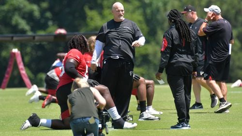 Falcons head coach Dan Quinn goes to work with his guys during some off-season training at Flowery Branch. (HYOSUB SHIN / HSHIN@AJC.COM)