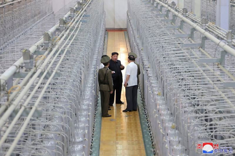 This undated photo provided on Friday, Sept. 13, 2024, by the North Korean government shows its leader Kim Jong Un, center, on an inspecting visit at what they say is an institute of nuclear weapons and a facility for nuclear materials at an undisclosed location in North Korea. Independent journalists were not given access to cover the event depicted in this image distributed by the North Korean government. The content of this image is as provided and cannot be independently verified. Korean language watermark on image as provided by source reads: "KCNA" which is the abbreviation for Korean Central News Agency. (Korean Central News Agency/Korea News Service via AP)