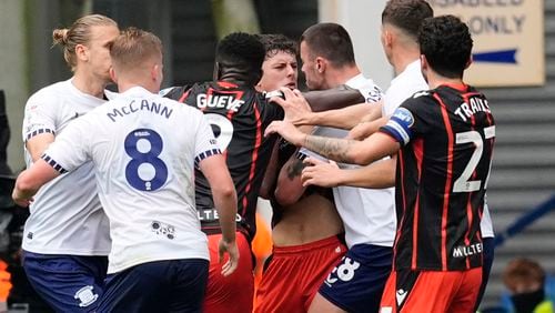 Blackburn Rovers' Owen Beck is confronted by Preston North End's Milutin Osmajic before being shown a red card, during an English Football League soccer match, at Deepdale, in Preston, England, Sunday, Sept. 22, 2024. (Nick Potts/PA via AP)