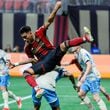 Atlanta United forward Tyler Wolff (28) landed on Philadelphia Union defender Damion Lowe (17) on a play by the box during the first half against the Philadelphia Union on Sunday, April 14, 2024.
 Miguel Martinez / miguel.martinezjimenez@ajc.com