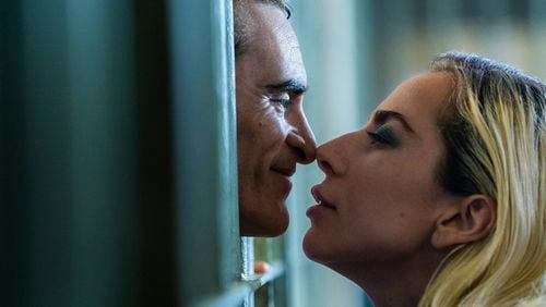 This image released by Warner Bros. Pictures shows Joaquin Phoenix, left, and Lady Gaga in a scene from "Joker: Folie à Deux." (Niko Tavernise/Warner Bros. Pictures via AP)