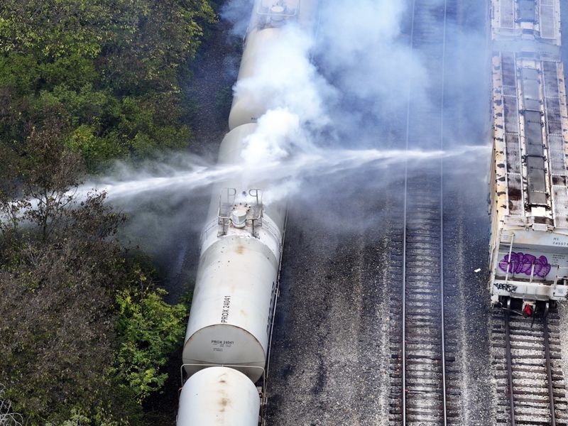 Firefighters work on the scene of a chemical leak in railcars near Cleves, Ohio, Tuesday, Sept. 24, 2024. (Local 12/WKRC via AP)