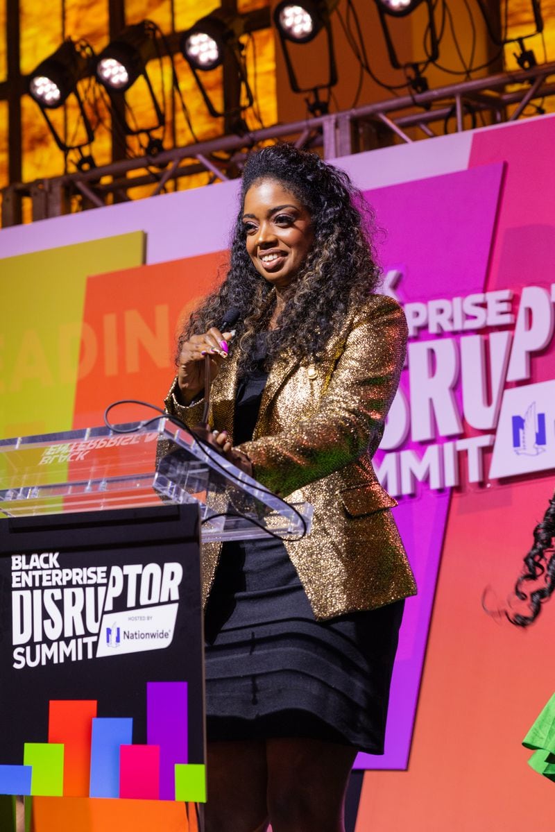 Fearless Fund founder Arian Simone speaking after accepting an award at the 2024 Black Enterprise Disruptor Summit in Atlanta.