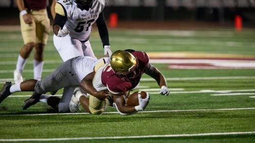 Brookwood's Alexander Diggs (15) is tackled during a GHSA high school football game between Mountain View and Brookwood at Brookwood High School in Snellville, GA., on Friday, Oct. 1, 2021. (Photo/Jenn Finch)