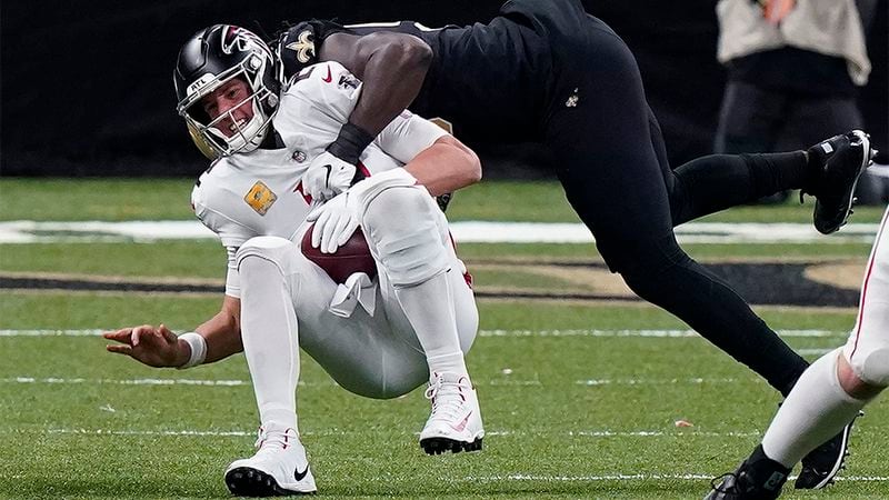 Falcons quarterback Matt Ryan is sacked by Saints outside linebacker Demario Davis in the second half Sunday, Nov. 22, 2020, in New Orleans. (Butch Dill/AP)