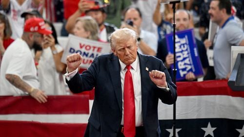 Former President Donald Trump dances as he leaves the stage during a rally at the Georgia State University’s convocation center on Saturday, August 3, 2024 in Atlanta. Former President Donald Trump and Vice-Presidential candidate JD Vance are holding their first rally together in Georgia on Saturday at the same place – the GSU Convocation Center- Kamala Harris held hers earlier this week.  (Hyosub Shin / AJC)