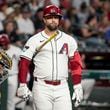 Arizona Diamondbacks' Christian Walker reacts after a pitch call against the San Diego Padres during the first inning of a baseball game, Sunday, Sept. 29, 2024, in Phoenix. (AP Photo/Darryl Webb)