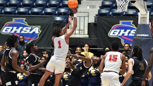 March 10, 2022 Macon - Tri-Cities' Noricco Danner (1) shoots over Eagle's Landing's AJ Barnes (5) during the 2022 GHSA State Basketball Class AAAAA Boys Championship game at the Macon Centreplex in Macon on Thursday, March 10, 2022. (Hyosub Shin / Hyosub.Shin@ajc.com)