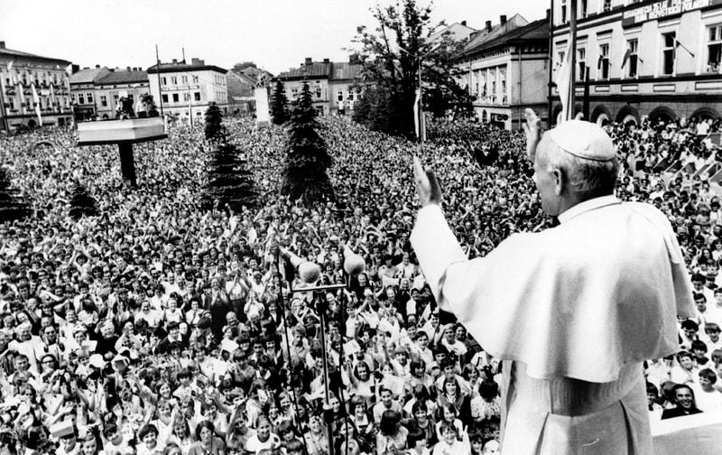 FILE - Pope John Paul II. waves to huge crowd of faithful downtown Wadowice, the hometown of the Pope he is visiting on June 7, 1979, for the first time he had been elected as Pope. It is the Pontiff's sixth day of his nine-day-visit to his homeland Poland. (AP Photo/POOL, File)