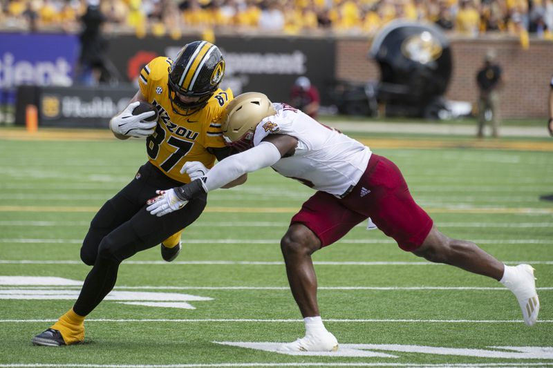 Missouri tight end Brett Norfleet, left, its tackled by Boston College linebacker Kam Arnold, right, during the first half of an NCAA college football game Saturday, Sept. 14, 2024, in Columbia, Mo. (AP Photo/L.G. Patterson)