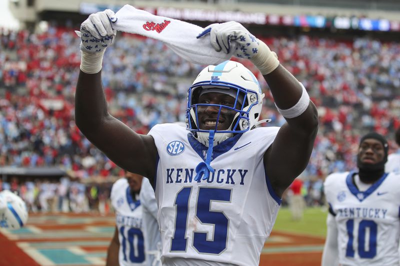 Kentucky tight end Khamari Anderson (15) holds up an Ole Miss towel after winning an NCAA college football game against Kentucky on Saturday, Sept. 28, 2024, in Oxford, Miss. Kentucky won 20-17. (AP Photo/Randy J. Williams)