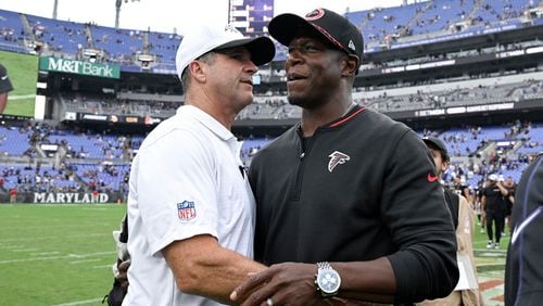 Baltimore Ravens head coach John Harbaugh, left, greets Atlanta Falcons head coach Raheem Morris after an preseason NFL football game, Saturday, Aug. 17, 2024, in Baltimore. (AP Photo/Terrance Williams)