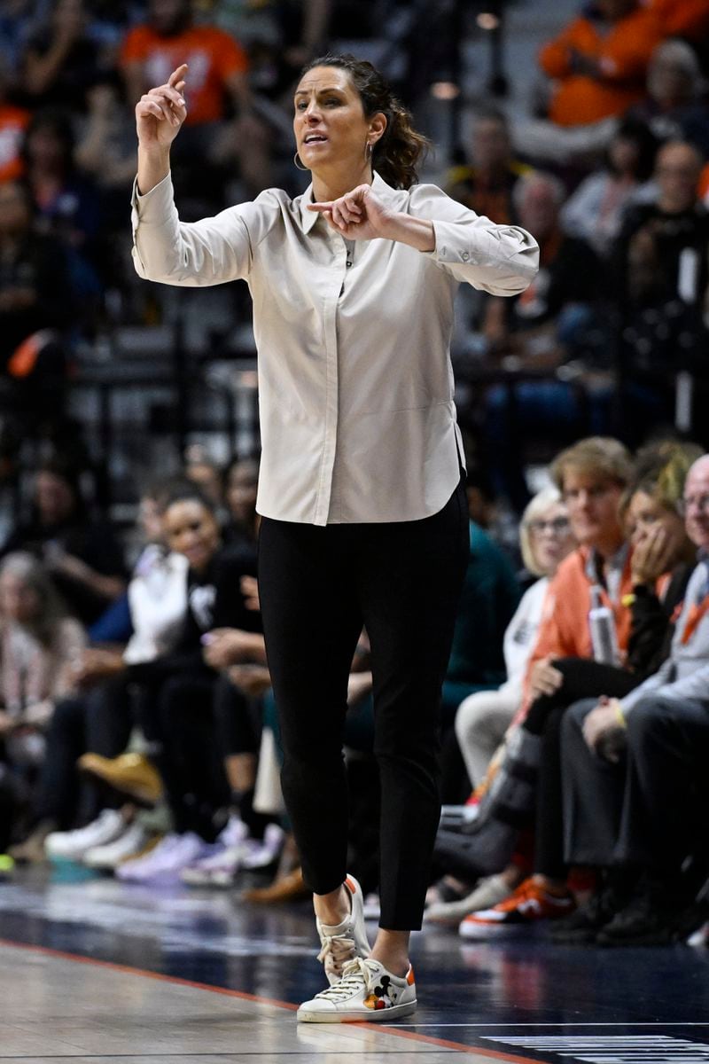 Connecticut Sun head coach Stephanie White gestures during the second half in Game 2 of a first-round WNBA basketball playoff series against the Indiana Fever, Wednesday, Sept. 25, 2024, in Uncasville, Conn. (AP Photo/Jessica Hill)