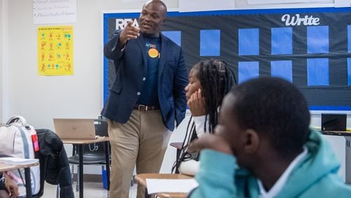 Superintendent Bryan Johnson (left) interacts with students at Sylvan Hills Middle School’s first day of class in Atlanta on Thursday, Aug. 1, 2024.  (Ziyu Julian Zhu / AJC)