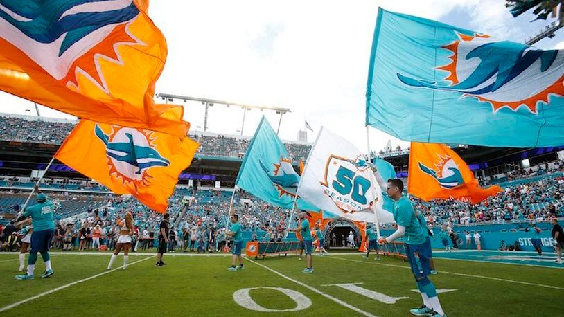 Dolphins coach Joe Philbin busts a move for his players