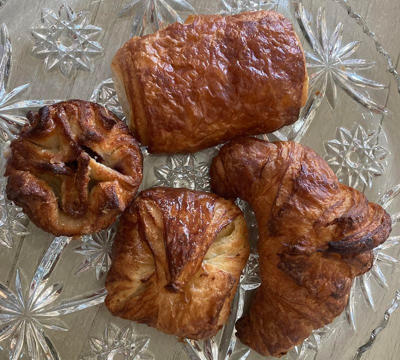 Among the baked delights available at Alon's are (clockwise from top) a chocolate croissant, a classic croissant, a cheese danish and a kouign-amann.  (Bill King for The Atlanta Journal-Constitution)