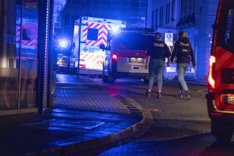 Police forces are deployed near the scene where people were killed and injured in an attack at a festival in Solingen, western Germany, the German dpa news agency reported, Friday, Aug. 23, 2024. (Gianni Gattus/dpa via AP)