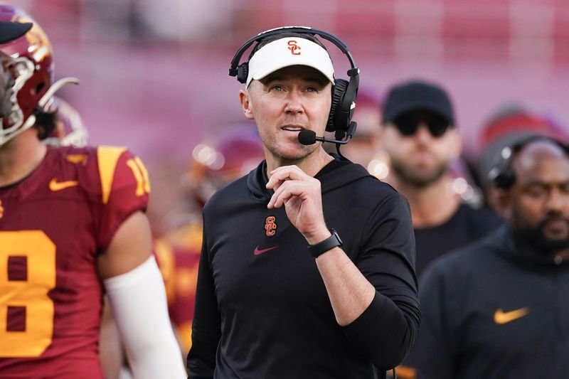 FILE - Southern California coach Lincoln Riley watches during the second half of the team's NCAA college football game against UCLA, Nov. 18, 2023, in Los Angeles. (AP Photo/Ryan Sun, File)