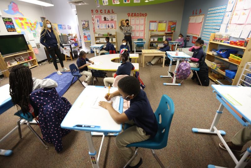 Second-grade teacher Candice Bellard interacts with students at Boyce L. Ansley School, a tuition-free, private school for children who have experienced homelessness. (Miguel Martinez for The Atlanta Journal-Constitution)