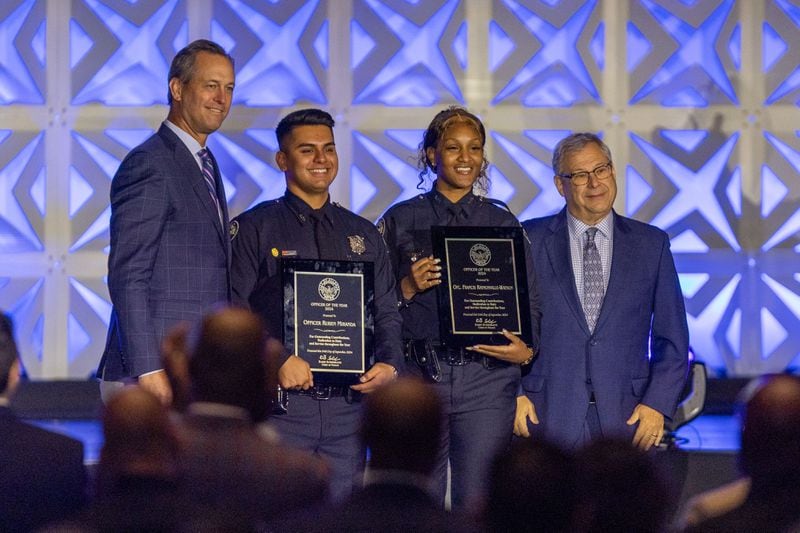 Ofc. Ruben Miranda and Ofc. Francis Raymondville-Jackson poses with Atlanta Braves CEO Derek Schiller and Atlanta Hawk CEO Steve Koonin as they received the Officer of the Year award during the annual “Crime is Toast” breakfast at the Georgia World Congress Center on Tuesday, Sept. 24, 2024.
(Miguel Martinez / AJC)