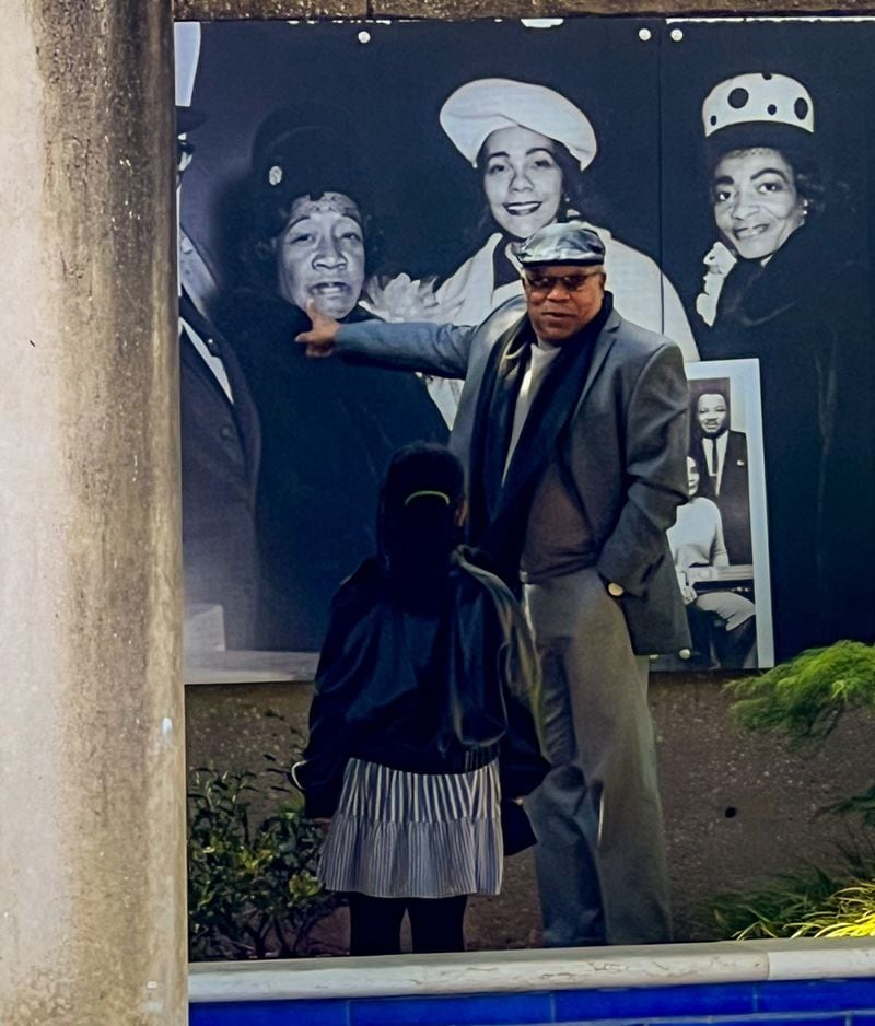 Derek King pontificates to a young relative at the King Center.