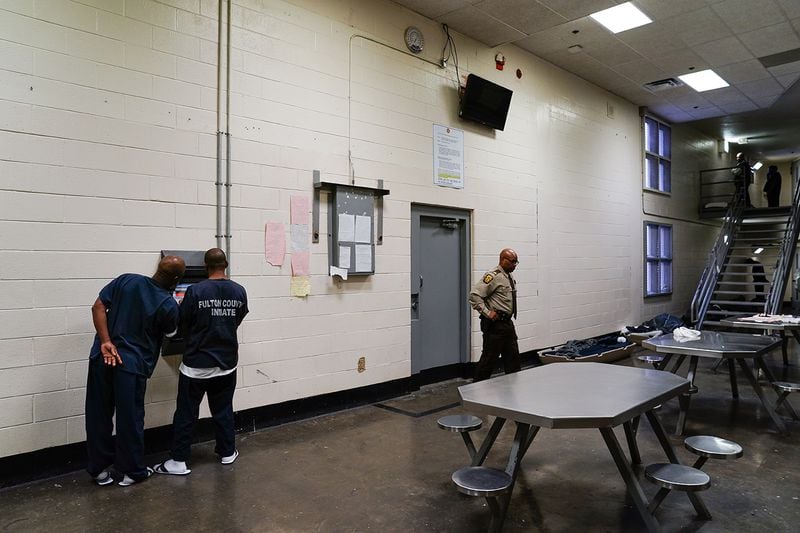 Inmates are seen using a kiosk in their cell block that allows them to schedule visits and medical appointments during a tour of the Fulton County Jail on Monday, December 9, 2019, in Atlanta. (Elijah Nouvelage/Special to the Atlanta Journal-Constitution)