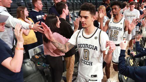 Georgia Tech guard Michael Devoe gives fans high-fives after his three-point play gave his team a 68-65 victory over Bethune-Cookman in the final seconds Sunday, Dec. 1, 2019, at McCammish Pavilon in Atlanta.